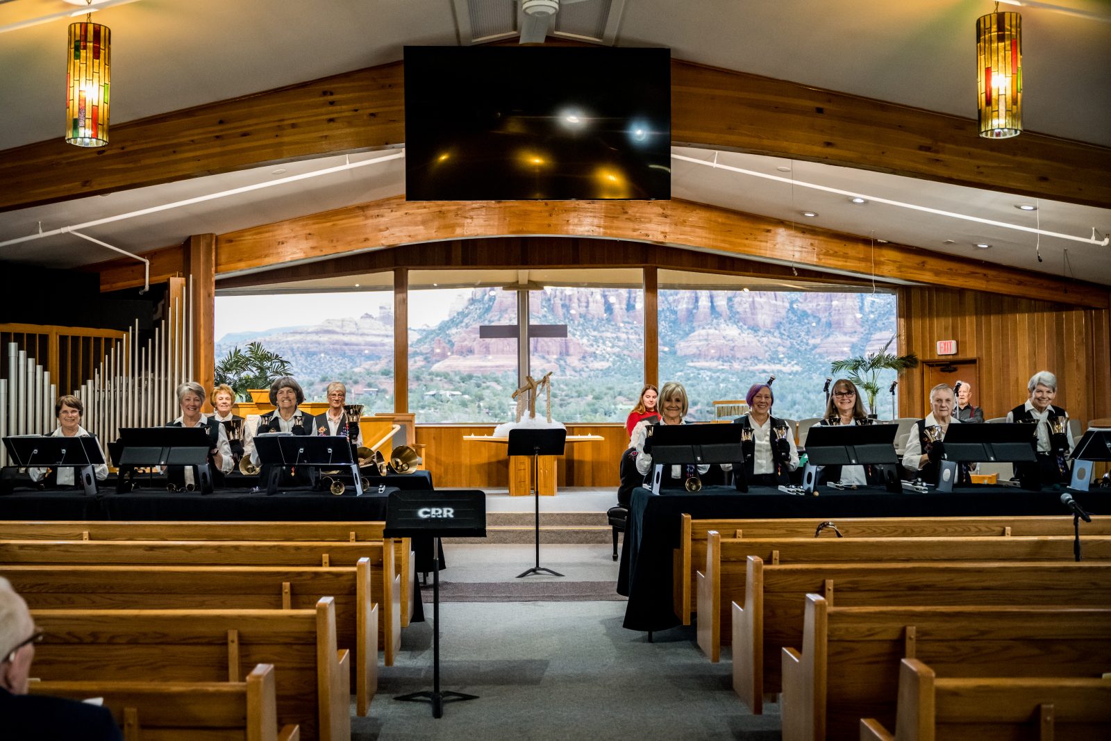 The Bell Choir member names in order from left to right are: Karen Barrow, Carol Weinhardt, Judith Glen, Joy Stouder, Dee Carr, Bonnie McKeon, Linda Westlin, Joyce Bethune, Penny Beers, Debbie Wych